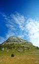 Dinara mountain over blue sky Royalty Free Stock Photo