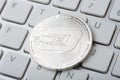 Dinero Coin - Crypto Currency close up on the computer keyboard Royalty Free Stock Photo
