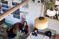 Diners enjoy their meals at a cafe adjacent to the bustling Talpiot market