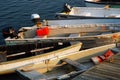 Dinghies are moored at a harbor