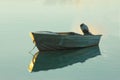 Dinghy anchored on a glassy sea at Sunrise