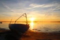 Dinghy on the beach at sunset Royalty Free Stock Photo