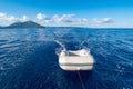 Dinghy (or dingey) inflatable small boat towed by a yacht in the