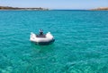 Dinghy Inflatable boat on turquoise blue sea water Royalty Free Stock Photo