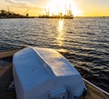 Dinghy on Pier With Shrimp Boats on The Amelia River at Sunset Royalty Free Stock Photo