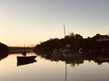 Dinghy silhouette one fine Pill Creek morn Royalty Free Stock Photo