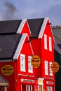 Dingle, Ireland - January 23, 2011: Traditional architecture of small hotel and bar in Dingle town, Ireland