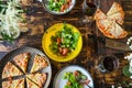 Dining al fresco. Dinner table with vegetable salad and pizza.