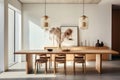 A dining area featuring a minimalist wooden table, modern dining chairs, and a statement pendant light. Royalty Free Stock Photo