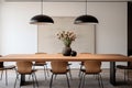 A dining area featuring a minimalist wooden table, modern dining chairs, and a statement pendant light.