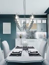 Dining area in the kitchen with a white dining table and chairs, in a classic style Royalty Free Stock Photo