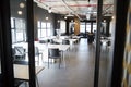 Dining area in the office of a creative business, seen from doorway in daylight, no people