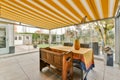 a dining area with a table and a glass patio Royalty Free Stock Photo