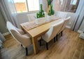 Dining Area With Wooden Table And Six High Back Chairs