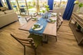 Dining Area With Wooden Chairs & Table With Place Settings Royalty Free Stock Photo