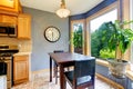 Dining breakfast table near the kitchen. Royalty Free Stock Photo