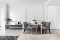 Dining corner with table and chair in a luxurious white room