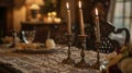 The dining room exudes elegance and charm with a stunning centerpiece of aged brass candlesticks sitting atop a lace
