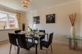 Dining room furnished with place settings