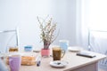 Dining room interior. bright room, on the table a lot of cups of delicate flowers and a bouquet of willow. easter concept