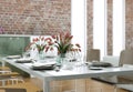 Dining room interior design in modern loft with stonewalls Royalty Free Stock Photo