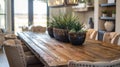 In the dining room a rustic wooden table is paired with modern highback chairs upholstered in a variety of earthy tones