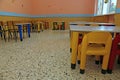 Dining room of a school for young children with small chairs and Royalty Free Stock Photo
