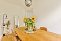 a dining room table with sunflowers on it Royalty Free Stock Photo