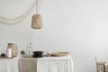 Dining room with wicker lamp, tray and basket