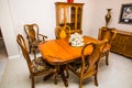 Dining Room Wooden Table, Chairs And Buffet Cabinet Royalty Free Stock Photo