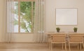 Dining seats next to the window in the living room with an empty picture frame on the wall in a bohemian style room in beige tone. Royalty Free Stock Photo