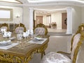 Dining table with baroque style chairs overlooking the foyer with a corridor