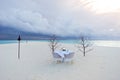 Dining table on the beach in maldives resort Royalty Free Stock Photo