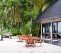 Dining table on beach in maldives resort Royalty Free Stock Photo