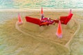 Dining table on beach at tropical Maldives island Royalty Free Stock Photo