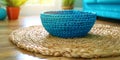 A dining table with a beige tablecloth and dishes made of natural materia