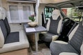 Dining table in camper van Giottiline Sienna 322C Royalty Free Stock Photo