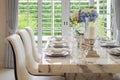 Dining table and comfortable chairs in vintage style