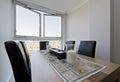 Dining table in a floor to ceiling window Royalty Free Stock Photo