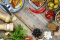 Dining table with grilled meat, rustic potatoes and pickled cucumbers. Concept of eating outdoors. Royalty Free Stock Photo