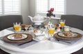 Dining table laid for breakfast Royalty Free Stock Photo