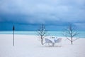 Dining table on the sand beach Royalty Free Stock Photo