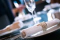 Dining table setting complete with silverware, cutlery and a fancy napkin Royalty Free Stock Photo