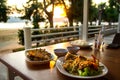 Dining table with seafoods with golden light on sunset Royalty Free Stock Photo