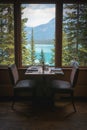 Dining table set in the restaurant with Emerald Lake view, CANADA Royalty Free Stock Photo