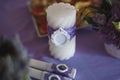 Dining table setting at Provence style, with candles, lavender, vintage crockery and cutlery, closeup Royalty Free Stock Photo