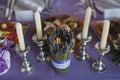 Dining table setting at Provence style, with candles, lavender, vintage crockery and cutlery, closeup Royalty Free Stock Photo