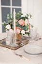 Dining table setting at Provence style, with candles, lavender, vintage crockery and cutlery, closeup. Royalty Free Stock Photo