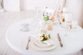 Dining table setting at Provence style, with candles, lavender, vintage crockery and cutlery, closeup. Royalty Free Stock Photo