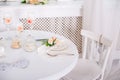 Dining table setting at Provence style, with candles, lavender, vintage crockery and cutlery, closeup. Royalty Free Stock Photo